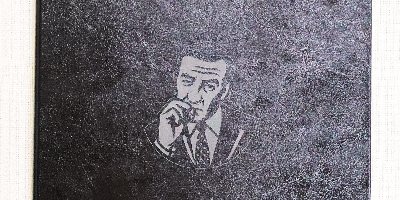 Black leatherette menu cover with laser engraved portrait of a man